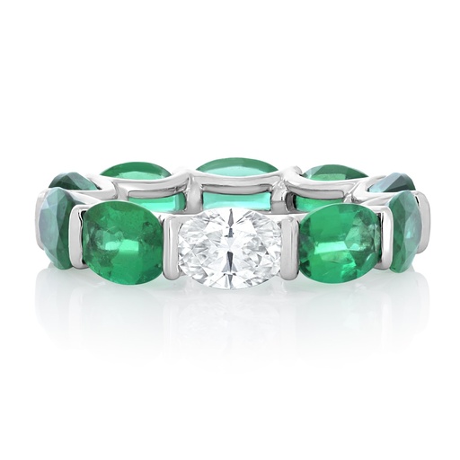 [R77289.5] Platinum Eternity Band With Oval Emeralds 6.50ct And An Oval Diamond Weighing 0.70ct